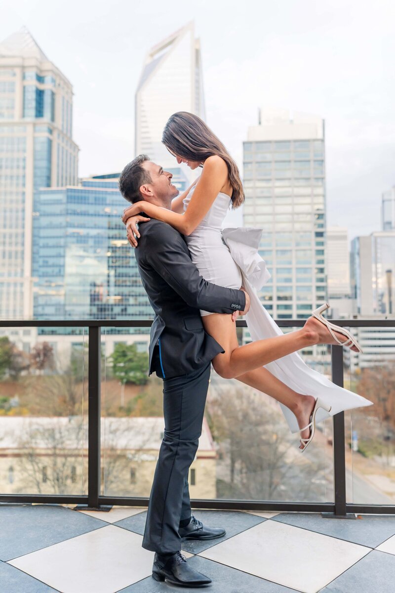 Close up engagement photo in Uptown Charlotte with soft cloudy light