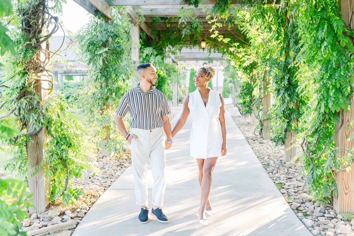 Romantic moment captured on the terrace at a North Carolina vineyard wedding venue.