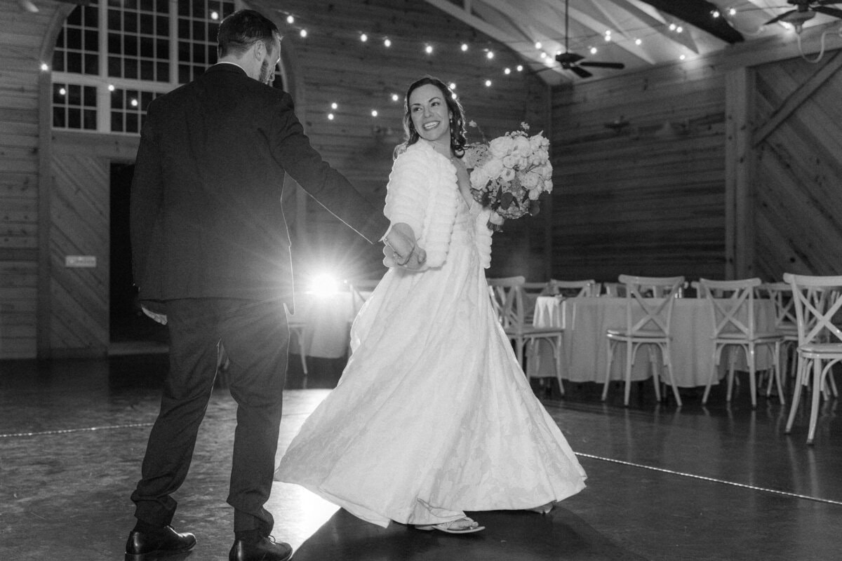 Couple dancing spontaneously at Alexander Homestead wedding while guests line up for bubble exit