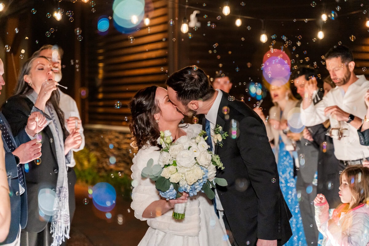Bride and groom bubble exit to getaway car at Alexander Homestead wedding Charlotte NC