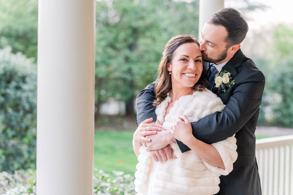 Bride and groom golden hour portraits at front of Alexander Homestead Victorian manor