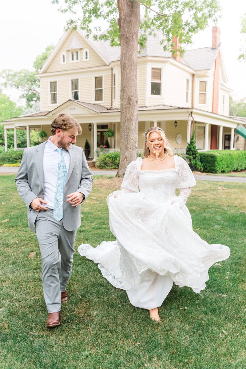 Bride and groom candid moment laughing during running portraits at Alexander Homestead, genuine emotion wedding photography Charlotte NC