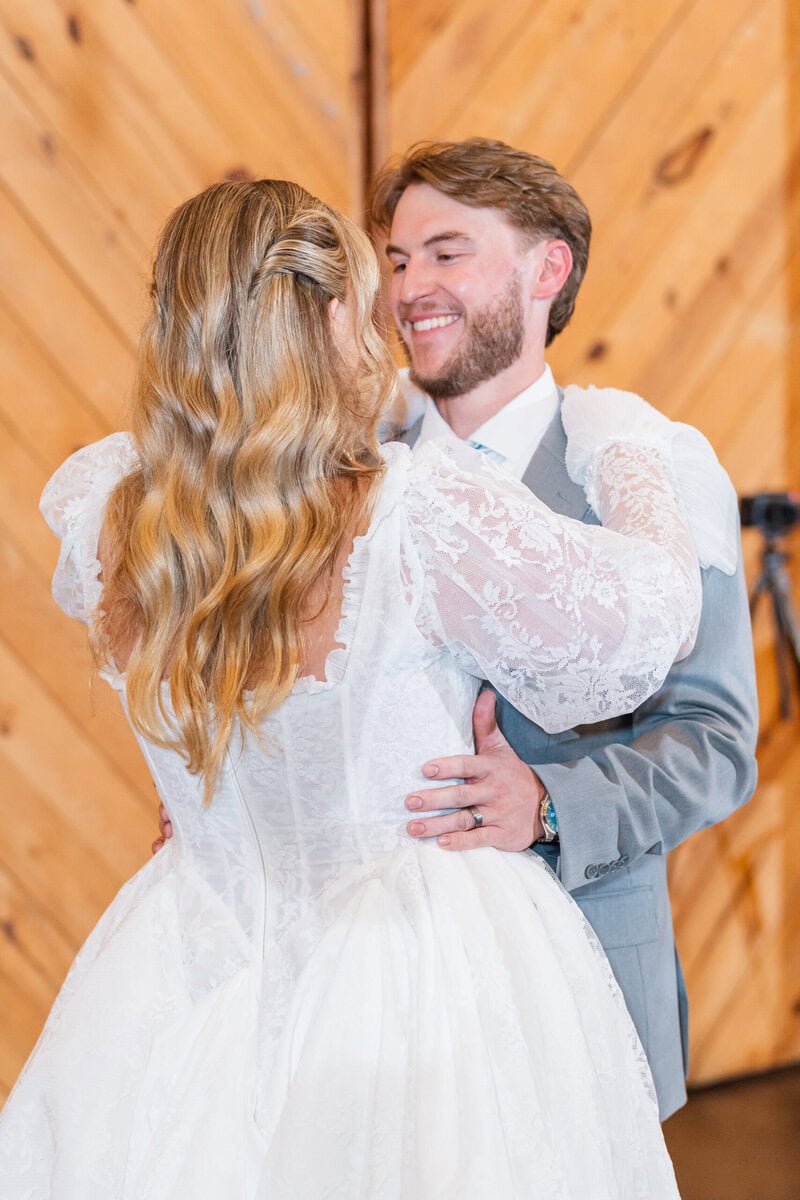 Bride and groom candid dance floor moment at Alexander Homestead by Wedgewood Weddings, Charlotte NC wedding photographer