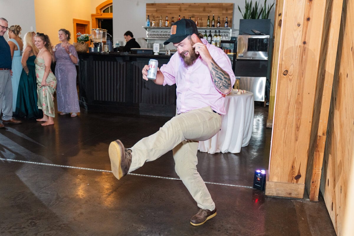 Candid reception moment of guests celebrating at Alexander Homestead, Charlotte NC wedding photos