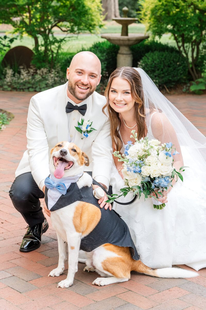 Couple with their dog during wedding portraits at Alexander Homestead Charlotte NC