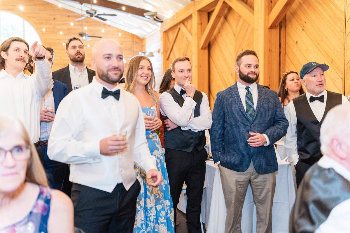 Guests watching Kentucky Derby at Alexander Homestead wedding reception Charlotte NC