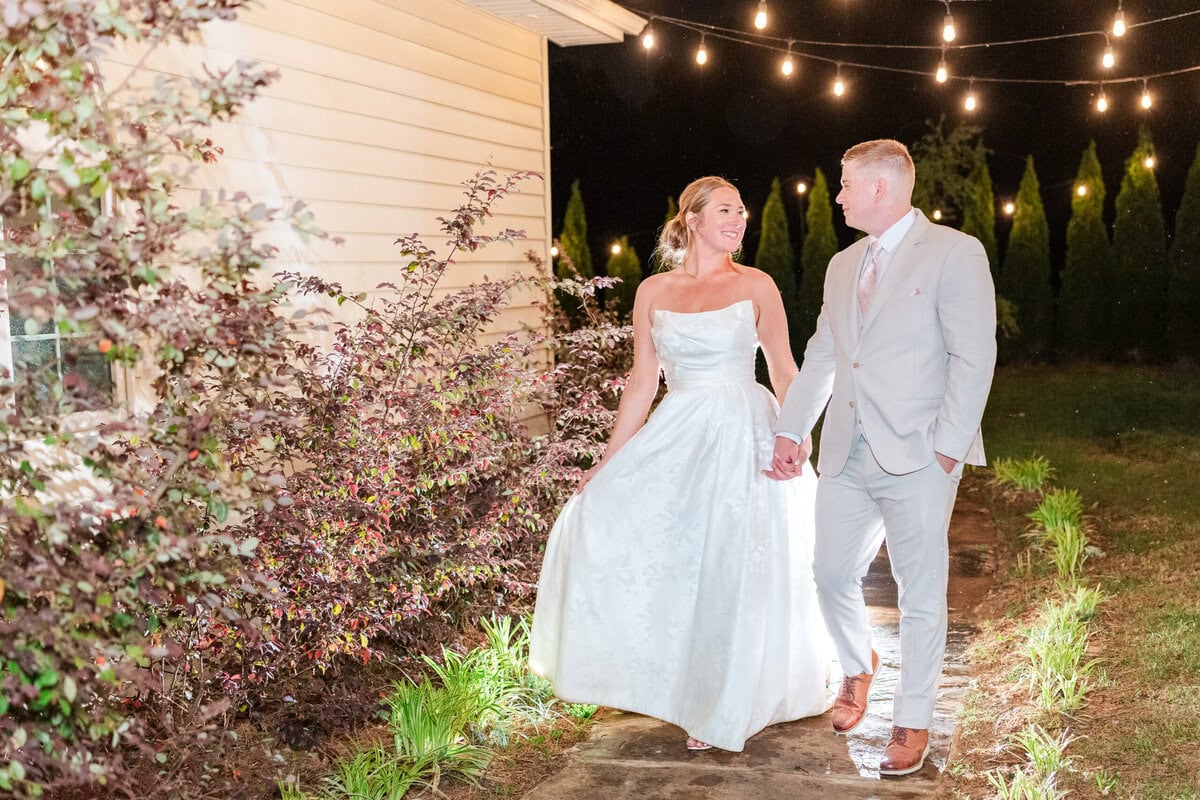 night portrait bride and groom glowing tent light Mariposa Chapel spring wedding NC