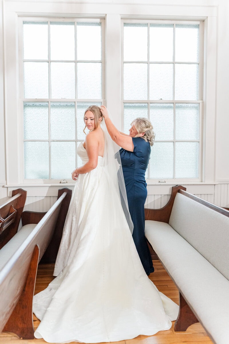 bride getting ready in Mariposa Chapel white chapel wedding Charlotte NC photographer
