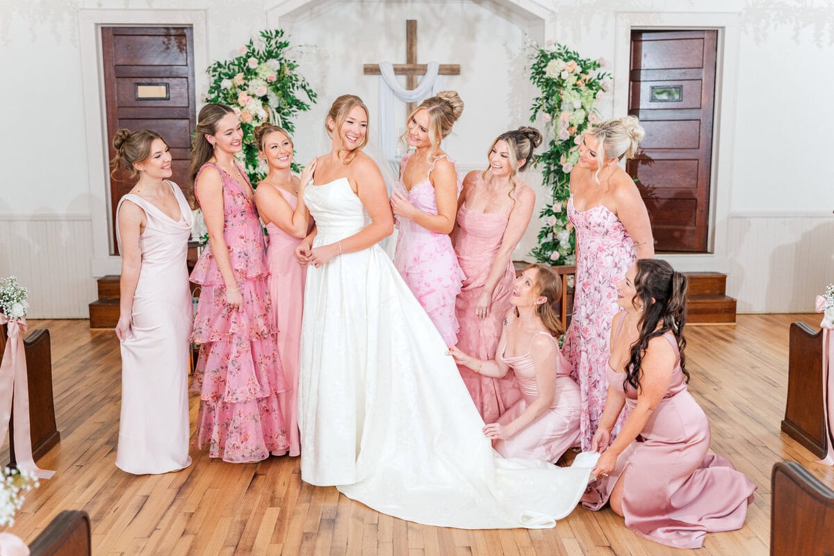 bridesmaids in mixed pink dresses at Mariposa Chapel spring wedding Iron Station NC