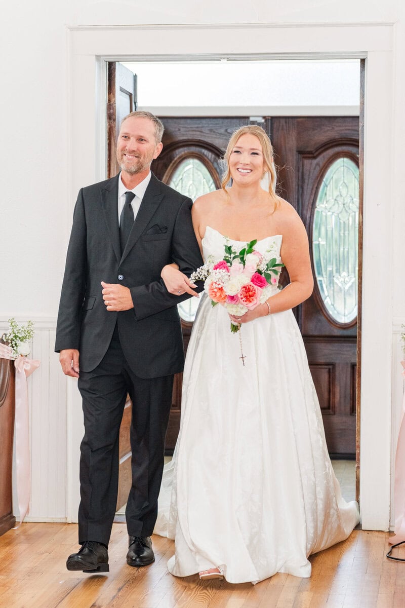 bride walking down aisle historic chapel Iron Station NC little white chapel wedding photographer