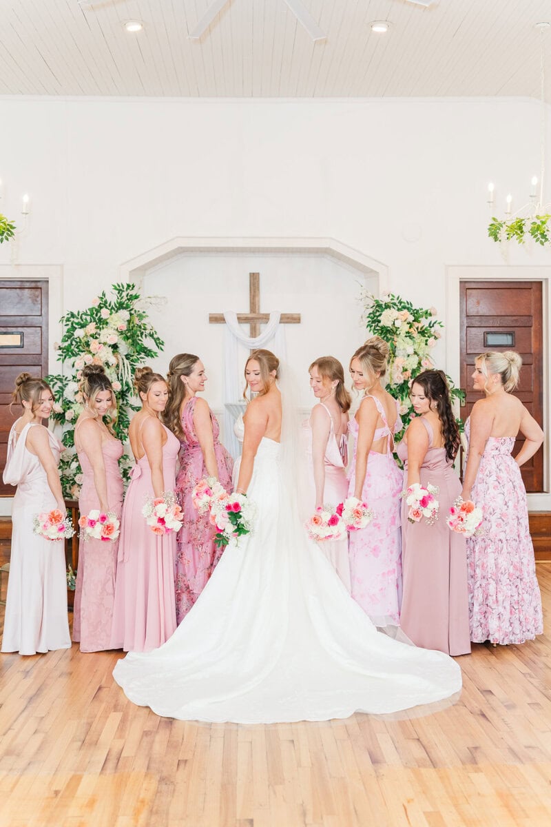 bridesmaids mixed patterned and solid pink dresses spring chapel wedding near Charlotte NC