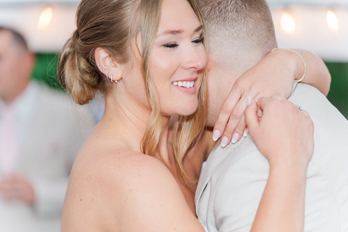 bride and groom first dance romantic white tent reception Mariposa Chapel NC spring wedding