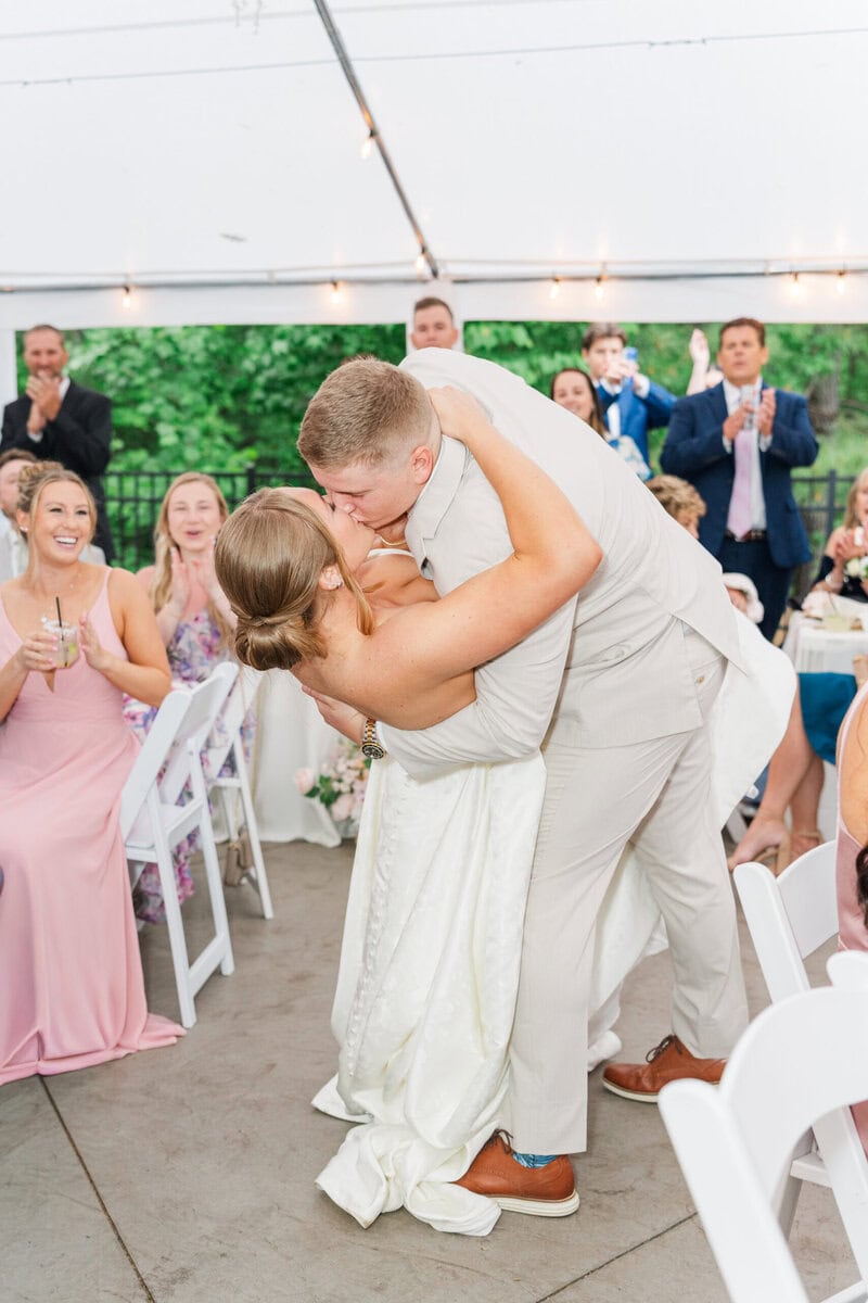 reception under white tent Mariposa Chapel rainy spring wedding Iron Station NC