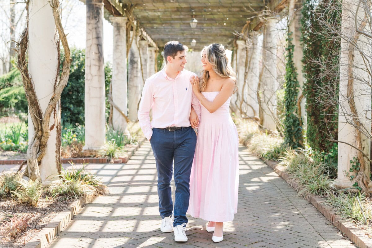 Couple portrait session at the columns outside the Orchid Conservatory at Daniel Stowe Botanical Garden North Carolina engagement and proposal photography