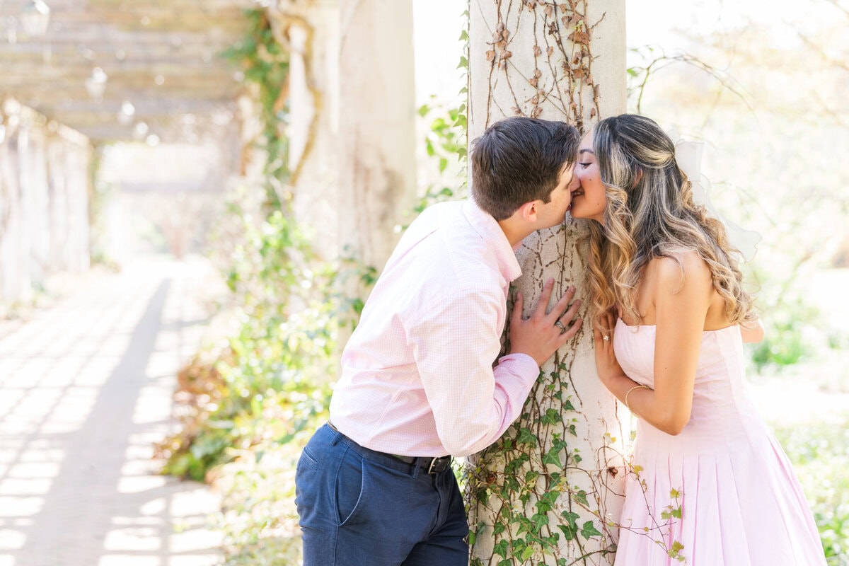 Newly engaged couple portrait session at the columns outside the Orchid Conservatory at Daniel Stowe Botanical Garden Belmont North Carolina