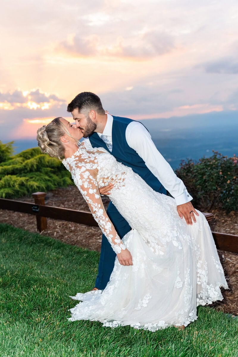 Pink purple orange sunset over Blue Ridge Mountains at Hidden Hill Venue Morganton NC wedding