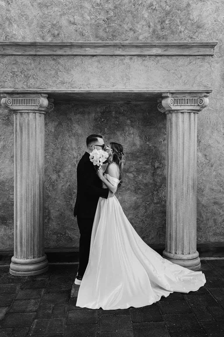 Timeless black and white photo of a couple on their wedding day, capturing romance and elegance.