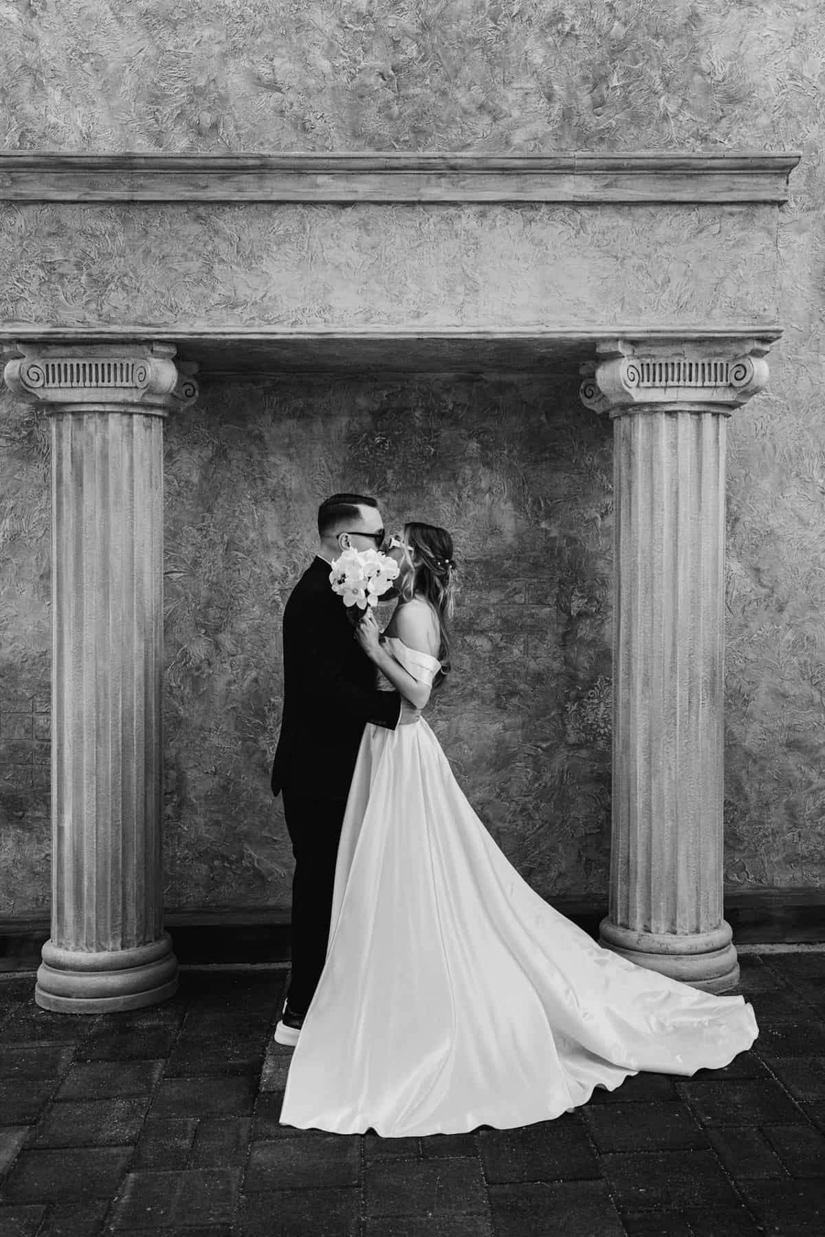 Timeless black and white photo of a couple on their wedding day, capturing romance and elegance.