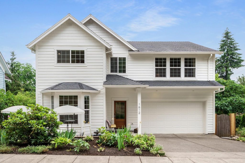 white farmhouse style home in town.