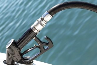 Close-up of fishing vessel steering gear in commercial fishing industry publication.