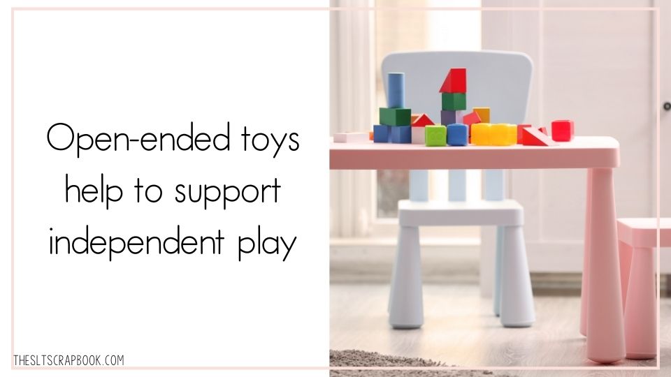 Horizontal image with a pale pink border. Black text on a white background reads "Open-ended toys help to support independent play". On the right are some blocks on a child's table.
