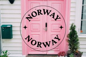 the words norway as a destination and a pink door