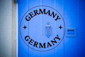 the words germany as a destination and a blue door