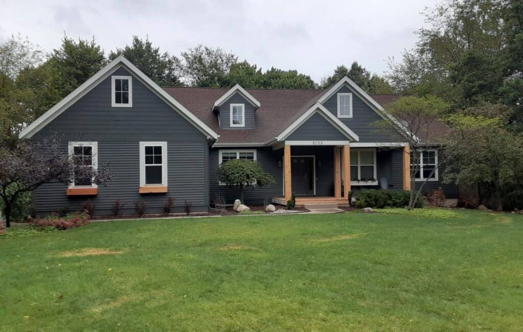 Modern house exterior painted with premium quality exterior paint, showcasing professional painting services and home improvement by Thornapple Painting.