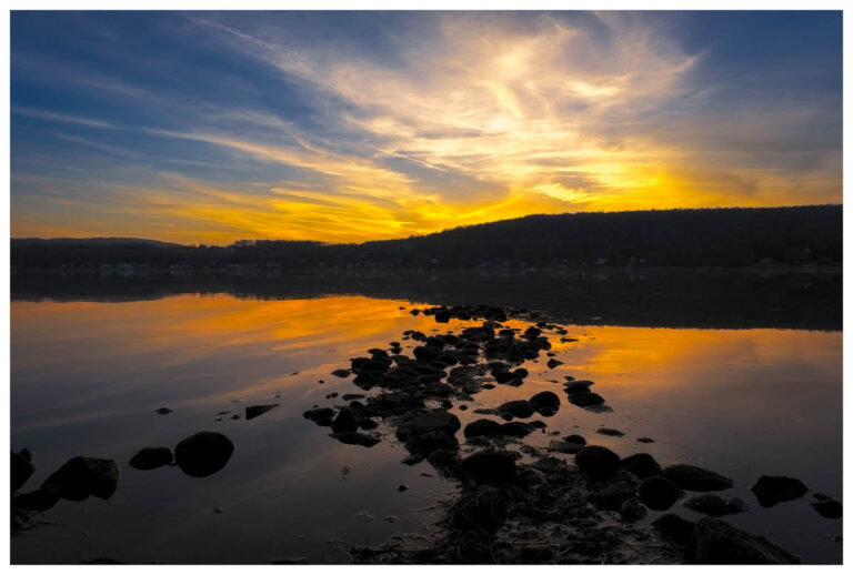 Rock spit in Otisco Lake leading to the sunset.