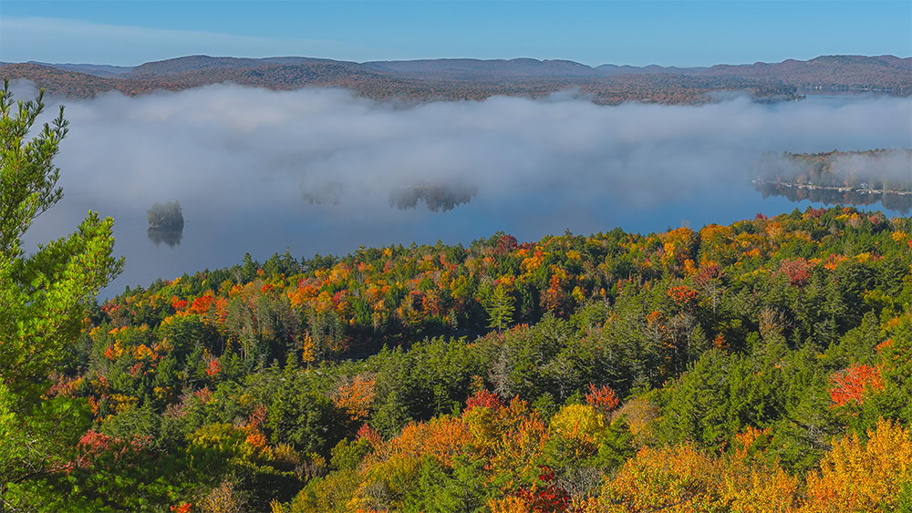 fourth lake in fog from rocky mountain in the adirondacks near inlet new york