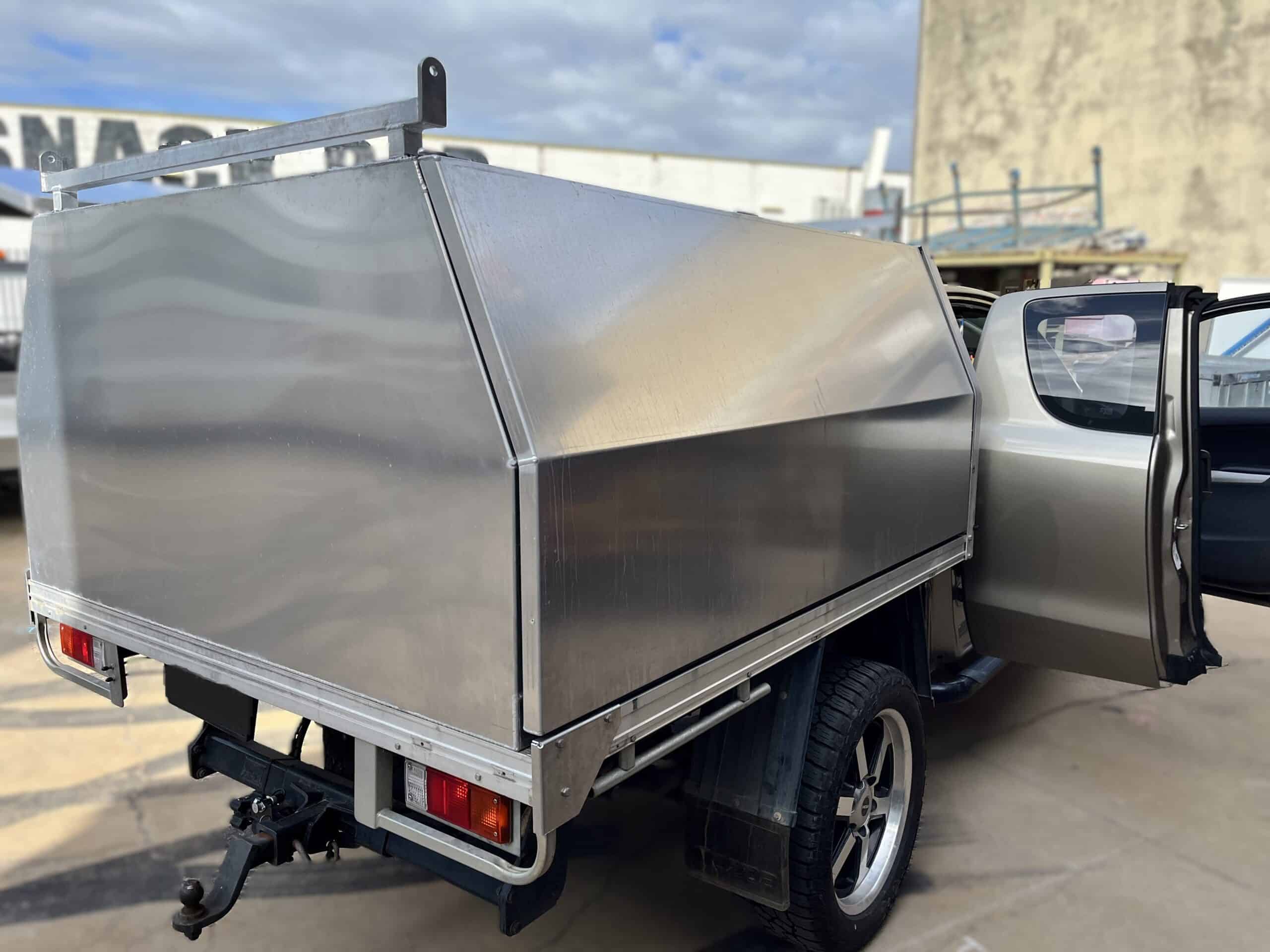 Stainless steel truck bed for auto electrical service vehicles. Durable, corrosion-resistant, ideal.