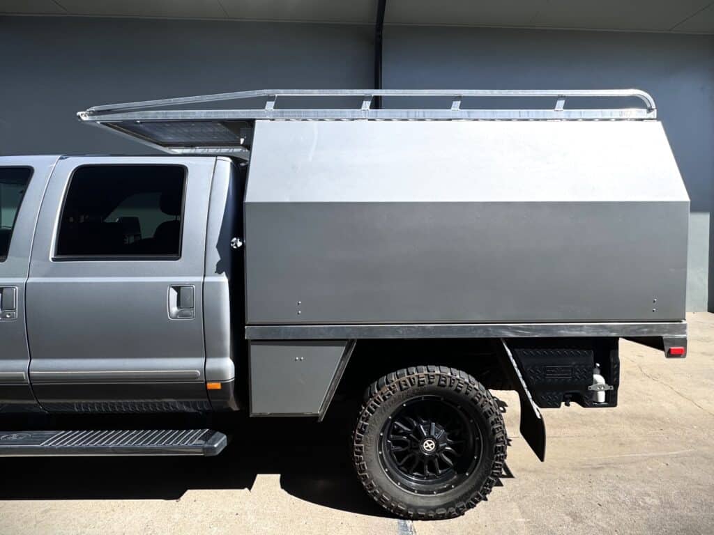Utility vehicle with custom storage box for tools and equipment.