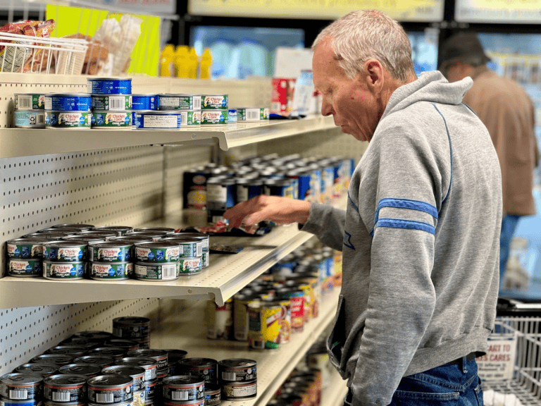 Neighbor shopping the no-cost market in Monument CO. Donate now to Tri-Lakes Cares