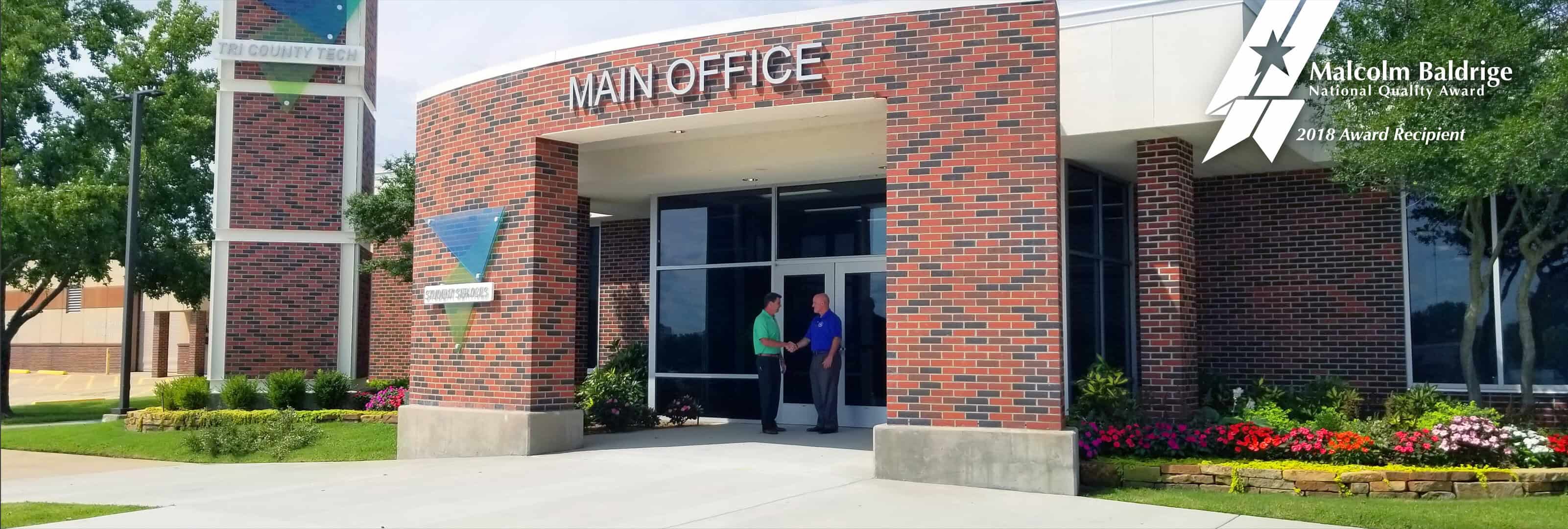 Fields and Roles shake hands.