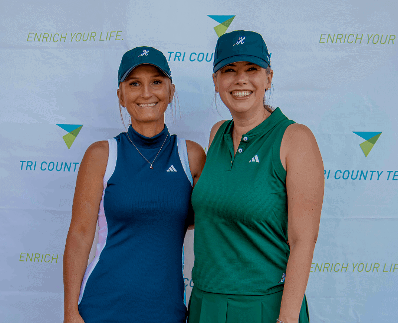 Two golfers enjoying the Tri County Tech Golf Tournament in Bartlesville