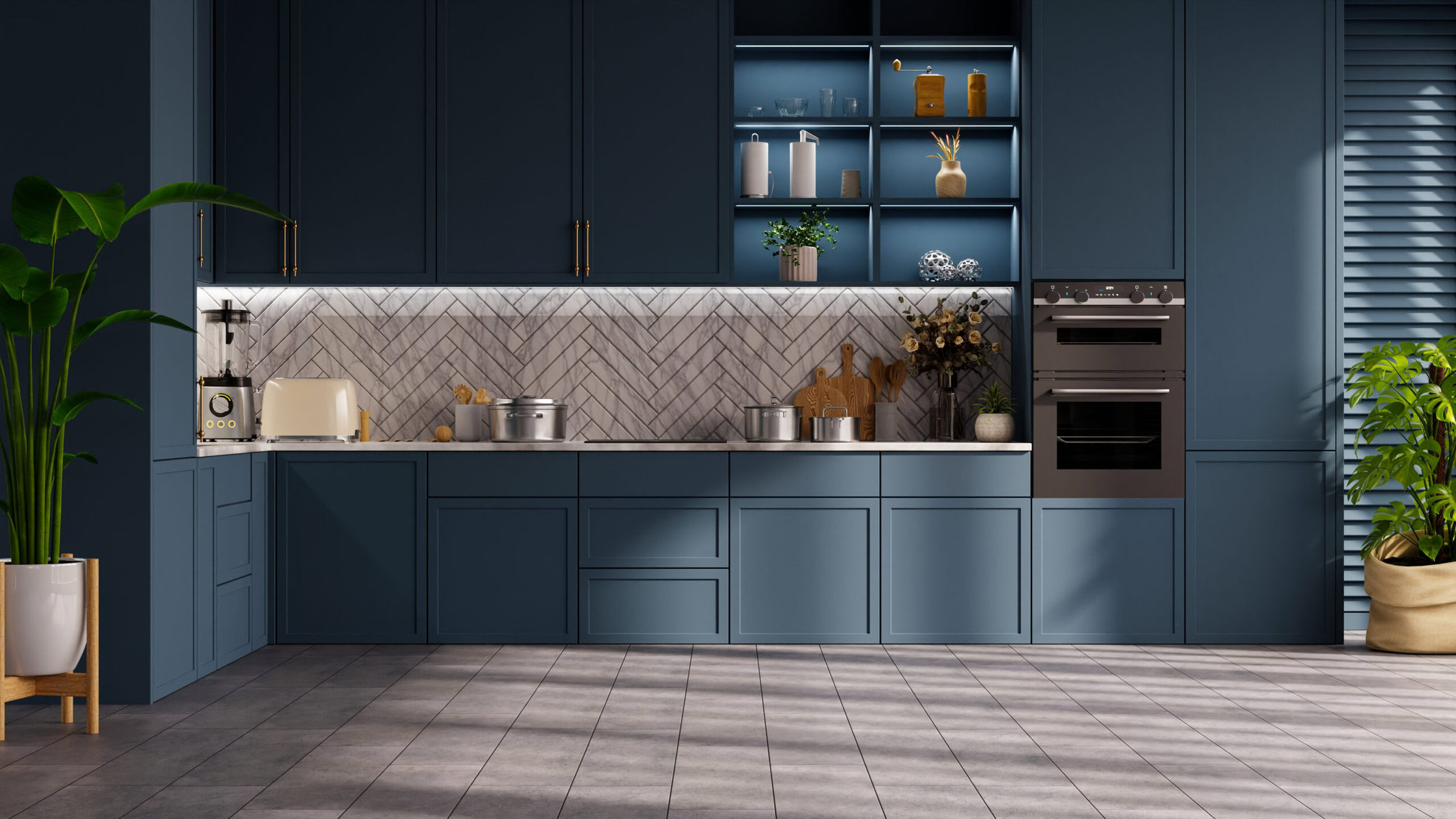 Modern dark blue kitchen with herringbone tile backsplash and plants