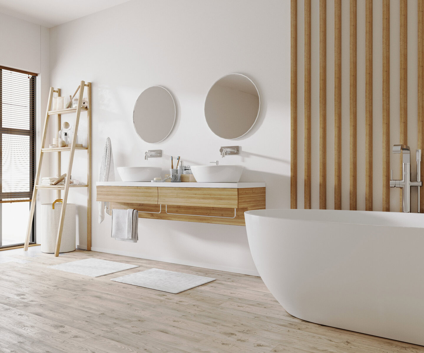 Modern bathroom with double vanity, two round mirrors, and a freestanding tub.