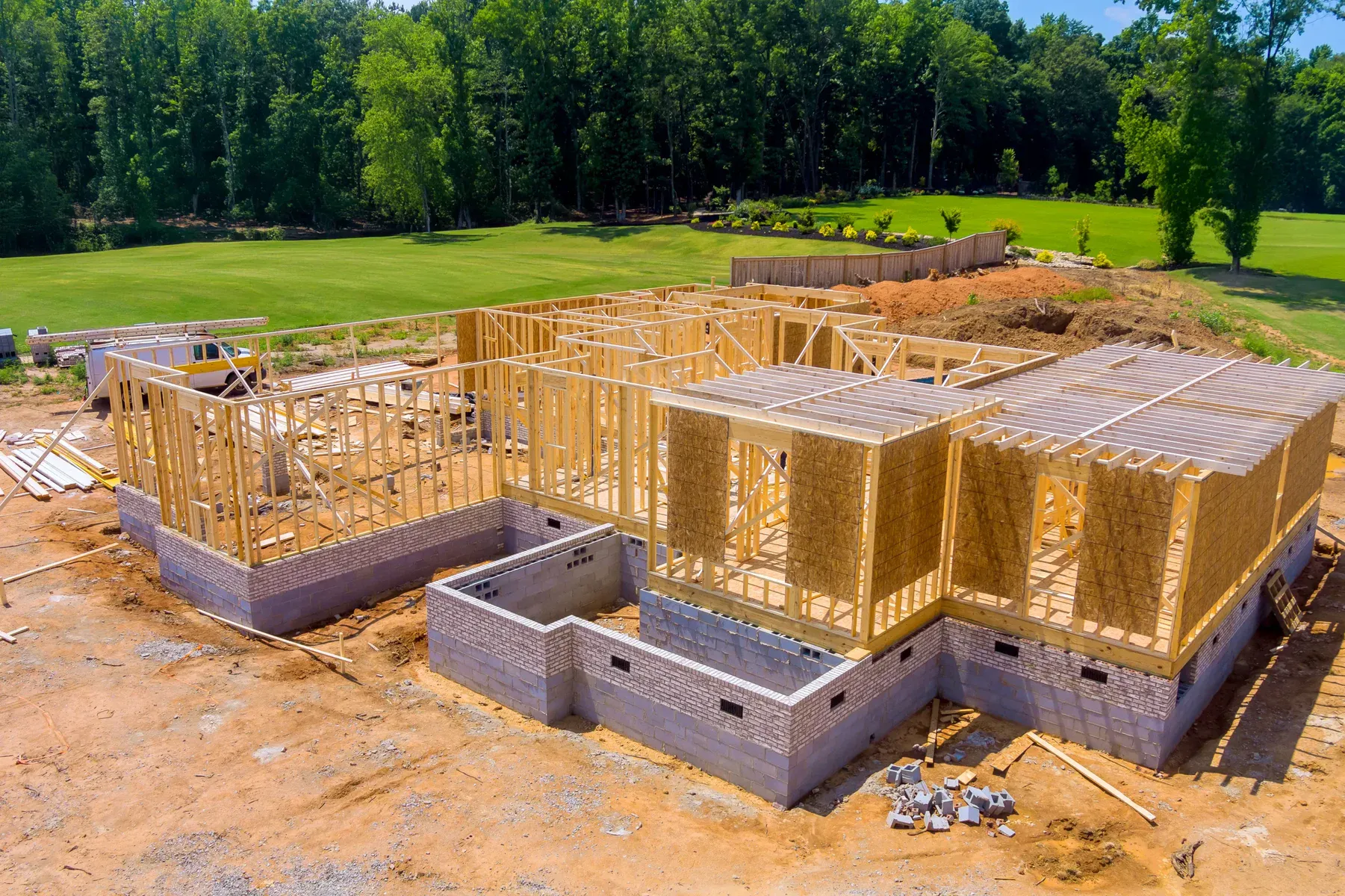 New house construction with wooden framing and concrete foundation
