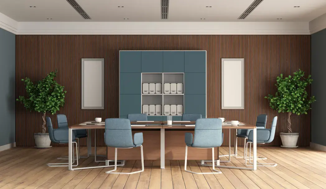 Modern conference room with a large table and blue chairs