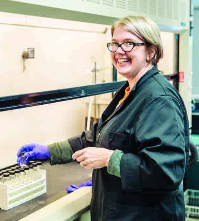 employee smiling because of her retirement planning