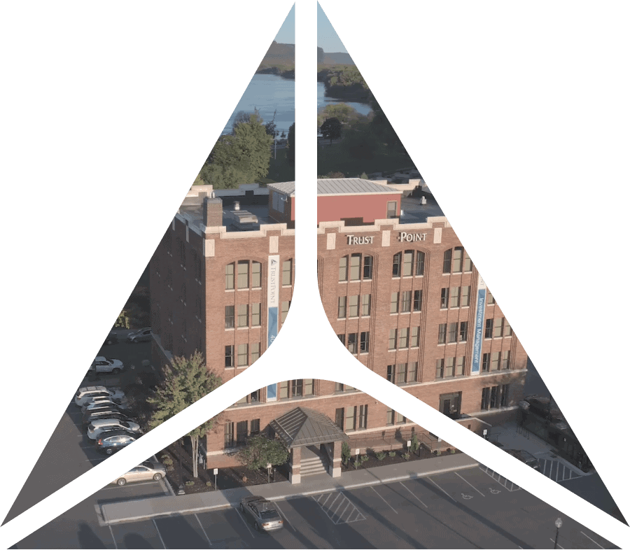 triangle shape over image of exterior of Trust Point image