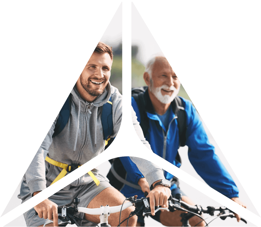2 men riding bikes behind triangle shape