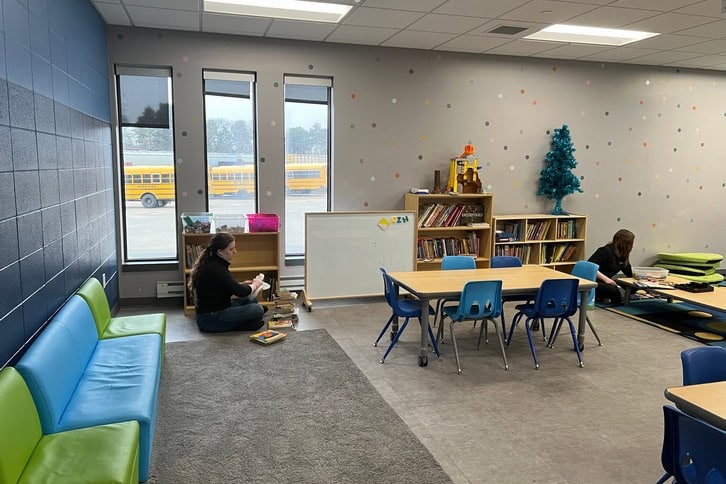 child care room with 2 workers cleaning