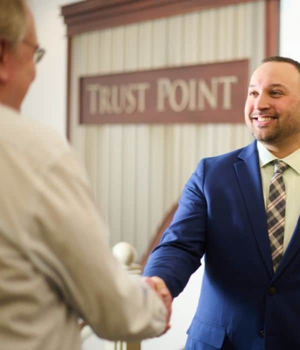 Business professional shaking a client's hand