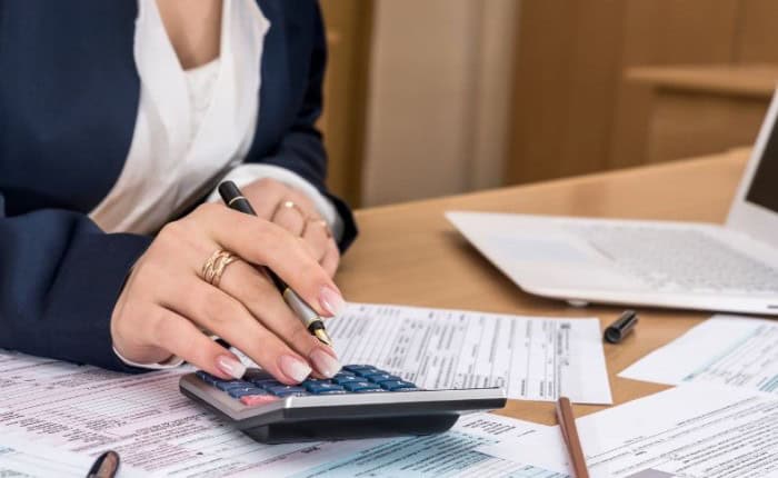 Woman calculating taxes