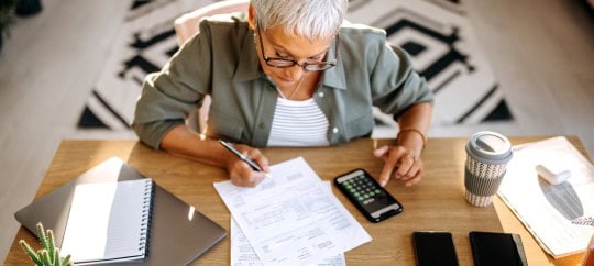 Woman looking at finances at home