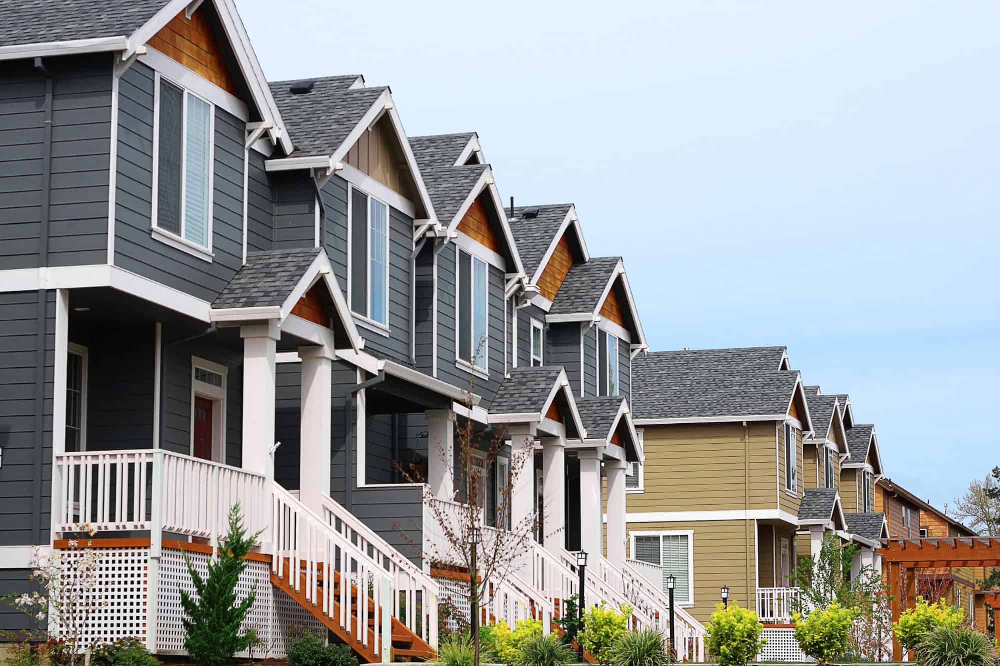 row of townhomes with blue sky in the background