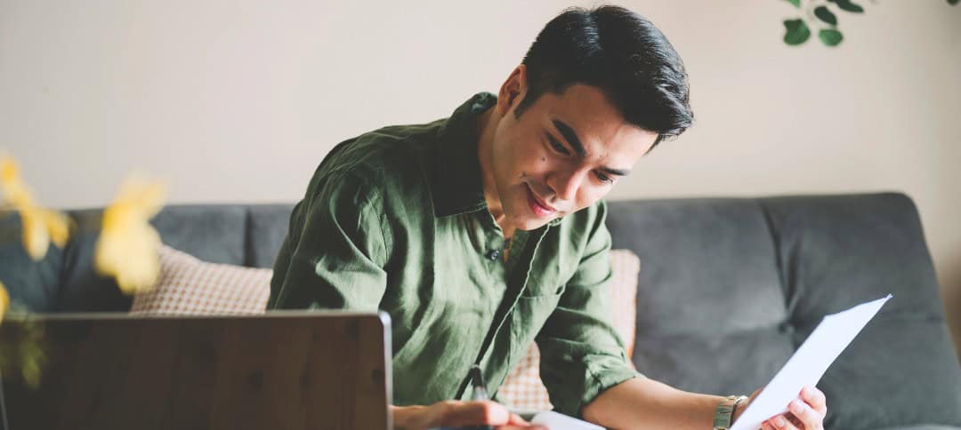 Man writing on a piece of paper