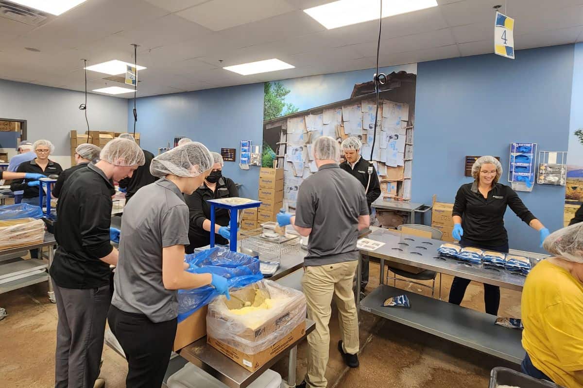 Trust Point Young Professionals Vounteering at Feed My Starving Children