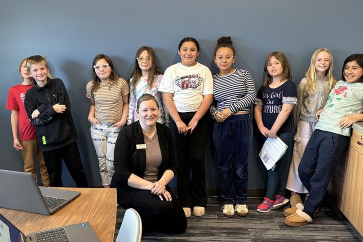 Ashley Hamby and a group of students at the Trust Point Foundation Financial Future Center